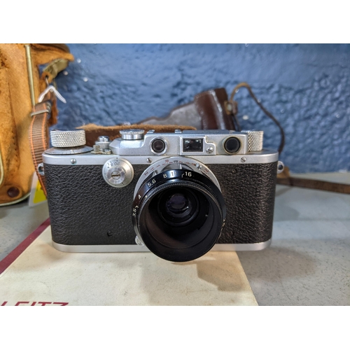 96 - An early to mid 20th century Leica D.R.P inscribed Erst Leitz Wetzlar, number 22575 in a brown leath... 