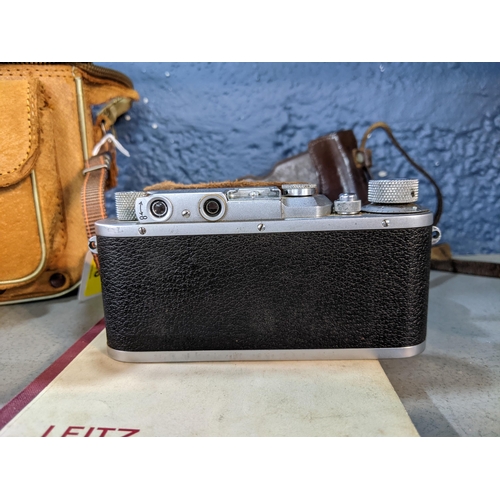 96 - An early to mid 20th century Leica D.R.P inscribed Erst Leitz Wetzlar, number 22575 in a brown leath... 