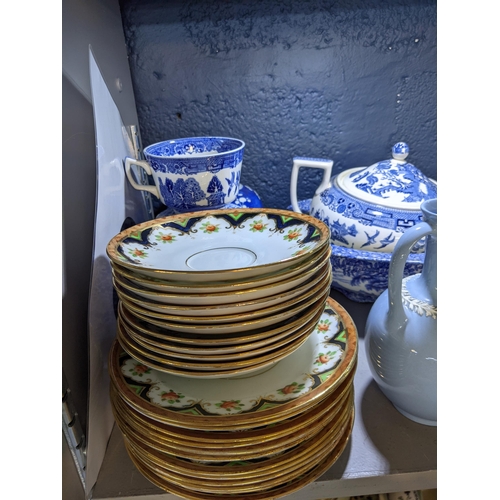 99 - A mixed lot of ceramics and china to include Wedgwood embossed Queensware, Old Willow and other patt... 