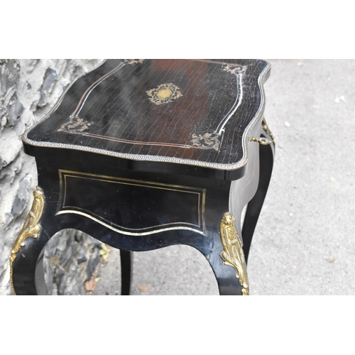 424 - A Napoleon III ormolu mounted ebonised dressing table, in the Louis XV style with brass inlaid top a... 