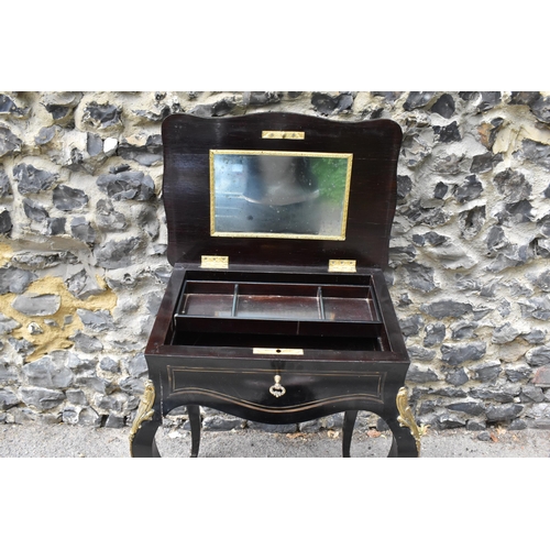 424 - A Napoleon III ormolu mounted ebonised dressing table, in the Louis XV style with brass inlaid top a... 