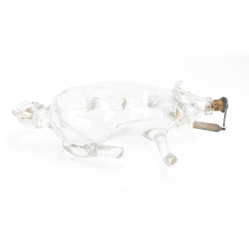 389 - An Edwardian hand blown clear glass novelty decanter, modelled as a seated pig, with silver whisky l... 