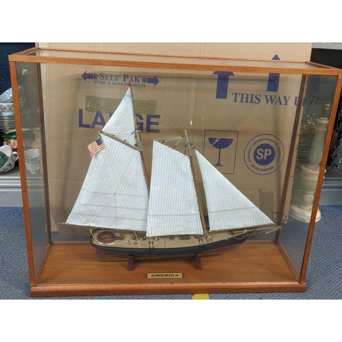 129 - A model of a sailing boat 'America' in a glazed case 
Location: A4F