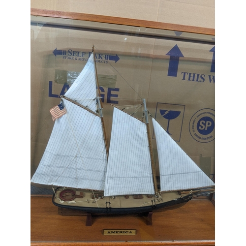 129 - A model of a sailing boat 'America' in a glazed case 
Location: A4F