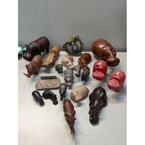 130 - A selection of African ornaments to include hippos, elephants and others 
Location: 11:3