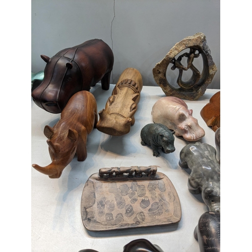 130 - A selection of African ornaments to include hippos, elephants and others 
Location: 11:3