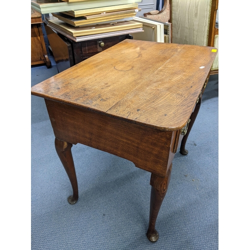 160 - A Georgian oak lowboy having three drawers and on cabriole legs with pad feet 69.5cm h x 77.5cm w 
L... 