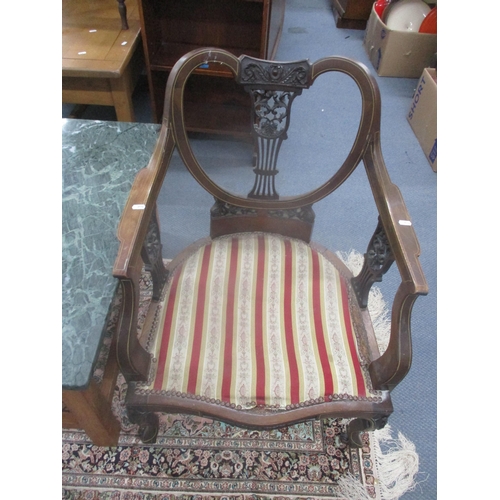 164 - A late Victorian mahogany saloon nursing chair together with a marble topped coffee table 
Location:... 