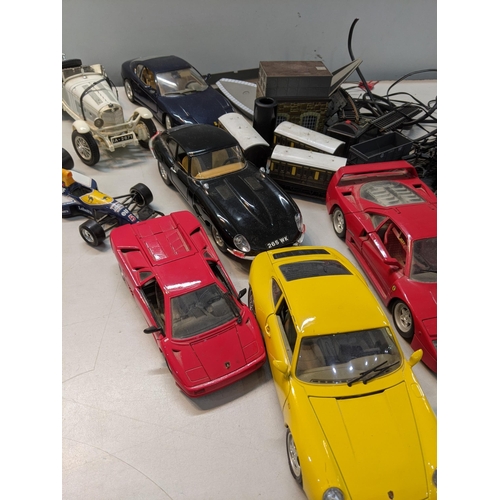 181 - A small collection of model cars to include a Burago Jaquar 