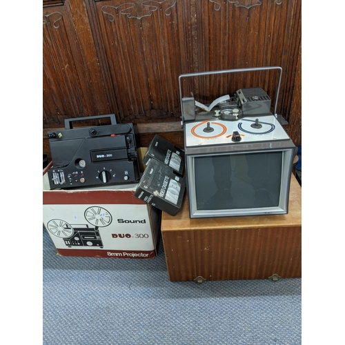 187 - A sound Duo - 300 8 mm Projector along with a vintage HV10 projector 8 mm films and two video casset... 