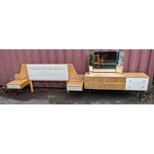 19 - A mid 20th century possibly G-Plan six drawer dressing table together with a similar headboard with ... 