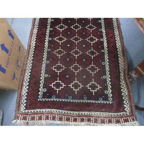 2 - An Iranian hand woven rug having red ground, geometric design and multi-guard boarders, 197cm x 106c... 