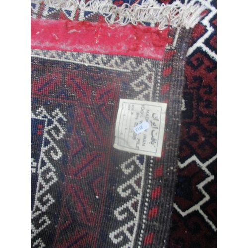 2 - An Iranian hand woven rug having red ground, geometric design and multi-guard boarders, 197cm x 106c... 