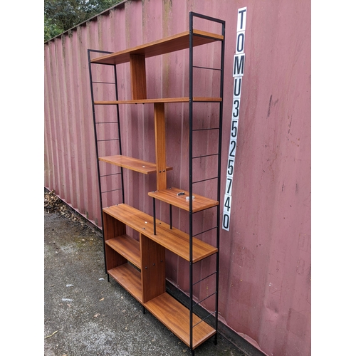 20 - A mid 20th century Ladderax style open bookcase, 211cm h x 122cm w
Location: CON