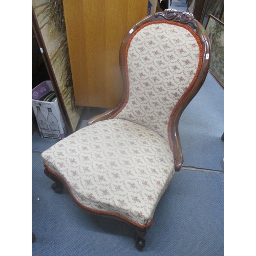 21 - A Victorian walnut spoon back nursing chair on front cabriole legs
Location: A1M