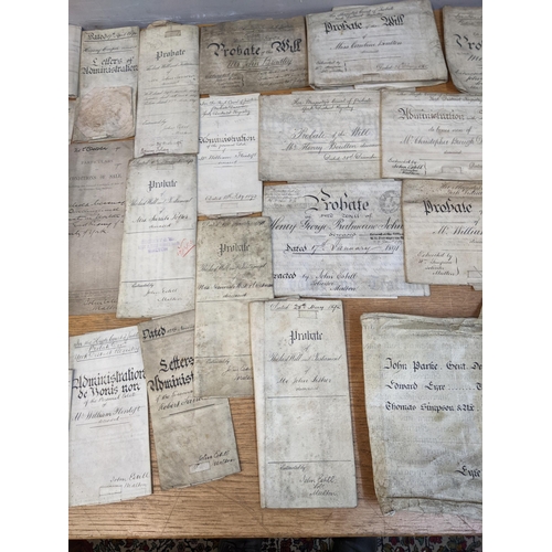 245 - A selection of early to late 19th century solicitors documents of letters of administration, probate... 