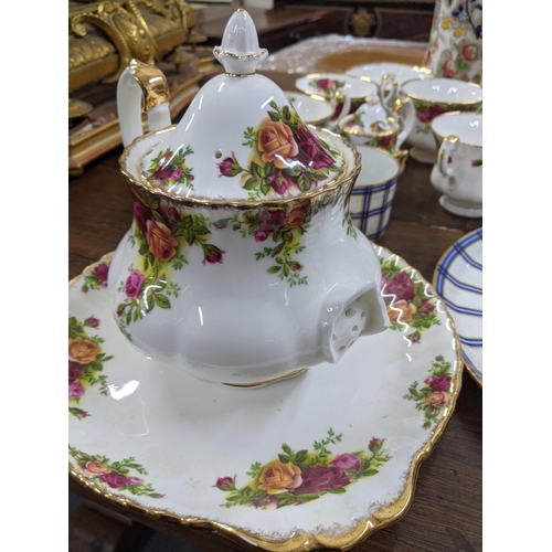 270 - A Royal Albert 'Old Country Roses' part tea service A/F and with early 20th century Limoges part tea... 