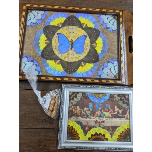 273 - A collection of blue Morpho butterfly and moth wing items to include two serving trays, a framed pri... 