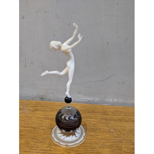 337 - A glass art deco figure of a a woman dancing on a ball stand
Location: 4.1