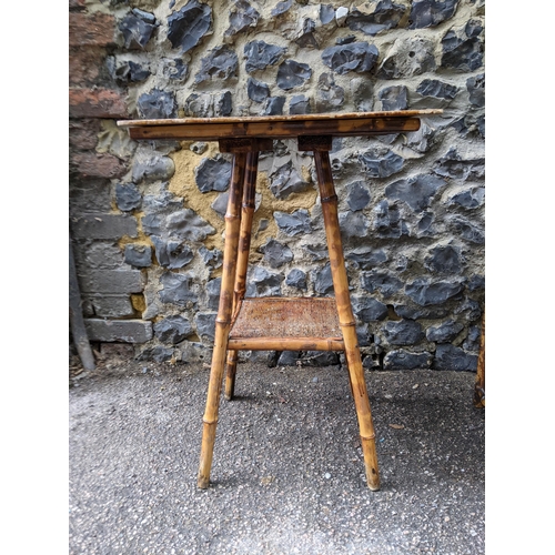 344 - A Victorian bamboo cabinet with glazed and curtained door internal shelves, on short feet, 80x54x36.... 