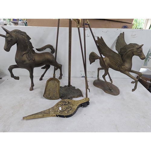 35 - A brass model of a Pegasus 40cm high, a similar model of a Unicorn, along with fireside implements a... 