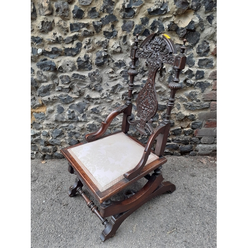 362 - An early 20th century carved oak rocking chair with a splat back
Location: RAB