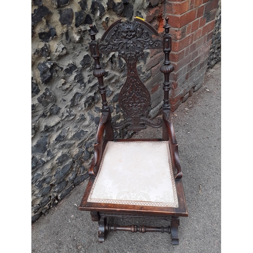 362 - An early 20th century carved oak rocking chair with a splat back
Location: RAB