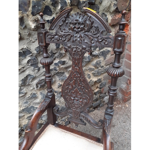 362 - An early 20th century carved oak rocking chair with a splat back
Location: RAB