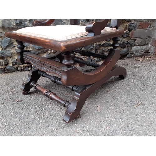 362 - An early 20th century carved oak rocking chair with a splat back
Location: RAB