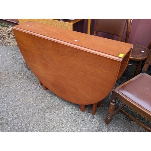 364 - A mixed lot of furniture to include a Formica kitchen table, retro teak fall flap table and other it... 