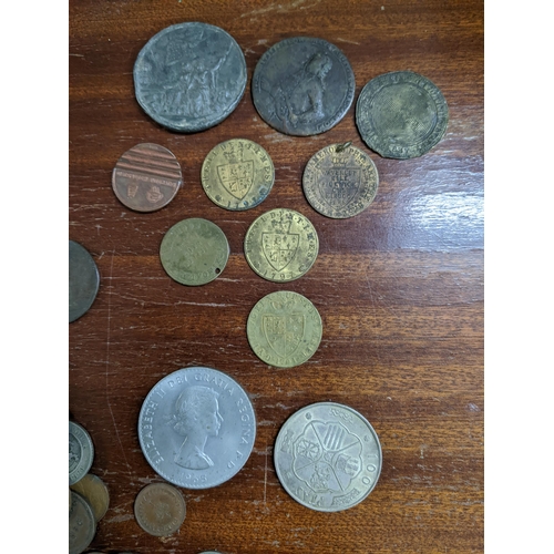 371 - A collection of British and foreign coinage and tokens to include George VI and III silver shillings... 