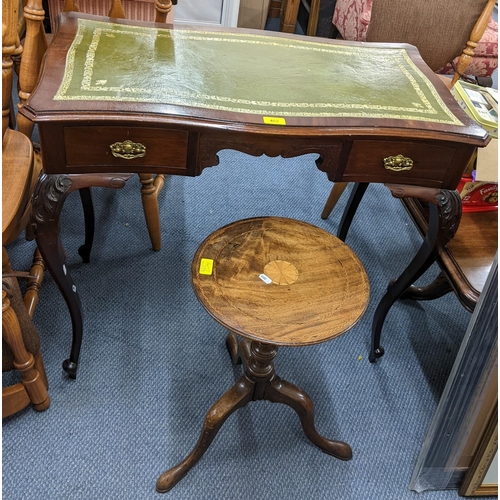 402 - An early 20th century and later mahogany wine table together with a serpentine desk having two drawe... 