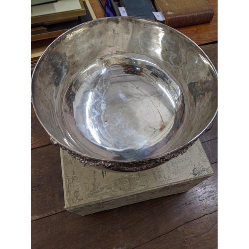 414 - A silver plated punch bowl having a rams head and floral design to the top in a Harrods box
Location... 