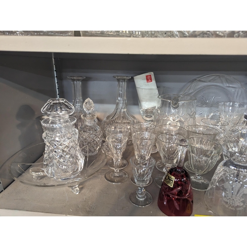 448 - A mixed quantity of domestic glassware to include decanters, cut crystal bowl, wine glasses, jugs an... 