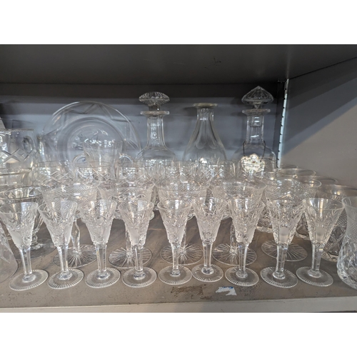 448 - A mixed quantity of domestic glassware to include decanters, cut crystal bowl, wine glasses, jugs an... 