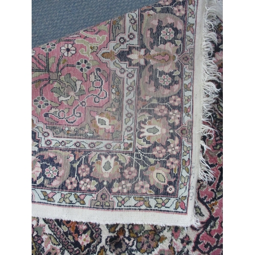 6 - A Persian silk hand woven rung having a central motif floral design and tasselled ends 195 x 121
Loc... 