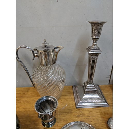 64 - A mixed lot of silver plate to include a pair of neo-classical style Edwardian candlesticks, two gla... 