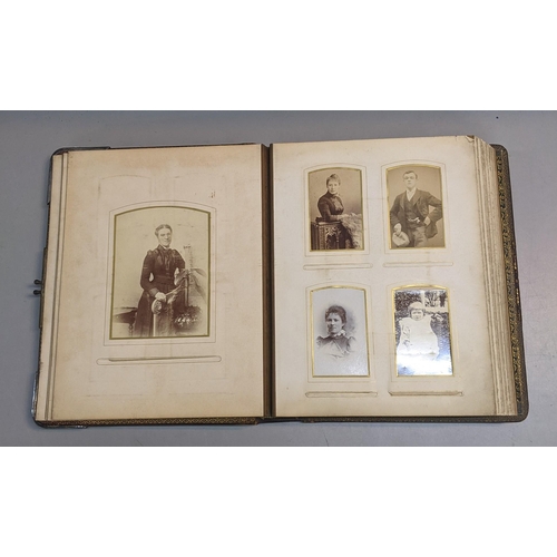 73 - A photograph album containing 19th century/early 20th century portraits and a post card album contai... 