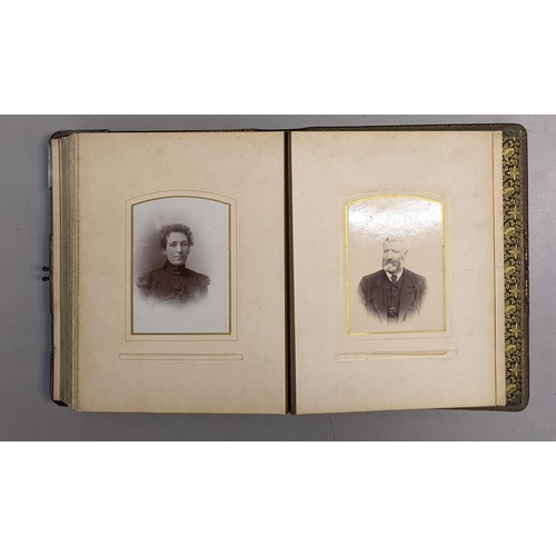 73 - A photograph album containing 19th century/early 20th century portraits and a post card album contai... 