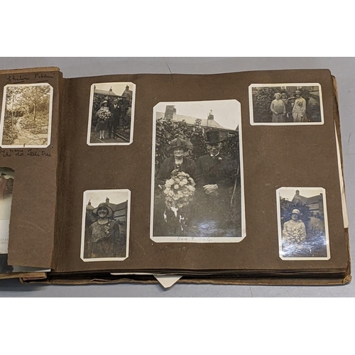 73 - A photograph album containing 19th century/early 20th century portraits and a post card album contai... 