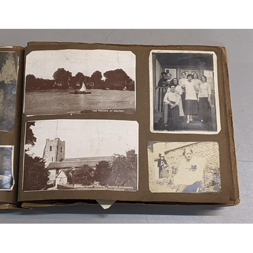 73 - A photograph album containing 19th century/early 20th century portraits and a post card album contai... 