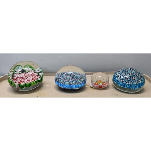 91 - Four Millefiori glass paperweights, largest dia 8cm, smallest 4cm
Location: