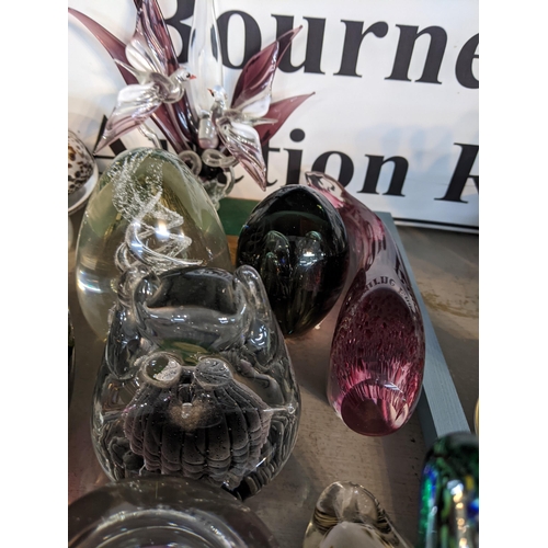 93 - A collection of glass animals and paperweights to include two owls, a fish, mushrooms and other item... 