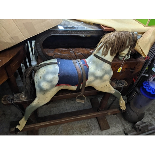 133 - Early 20th painted wooden rocking horse on wooden safety base as a dapple grey with leather bridle a... 