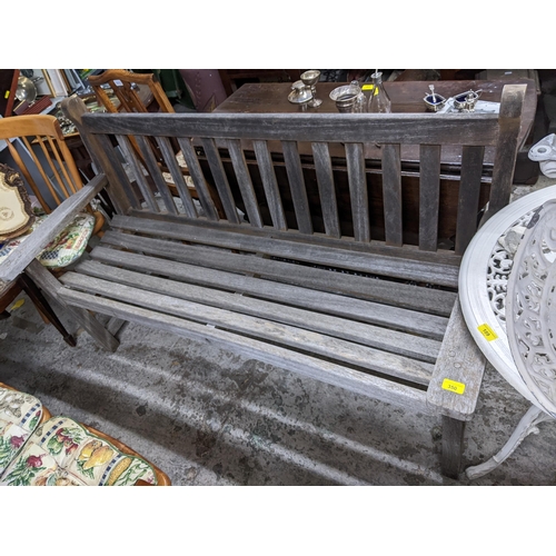 350 - A teak slatted garden bench 93cm x 156cm x 51cm Location: G