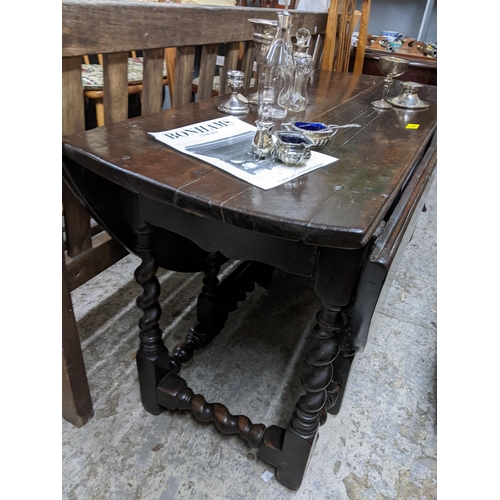 440 - A late 17th century oak drop leaf table with barley twist legs
Location: G