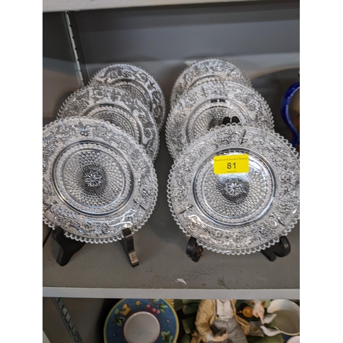 81 - A set of six crystal cake plates with an intricate design to the centre and a scroll design to the b... 