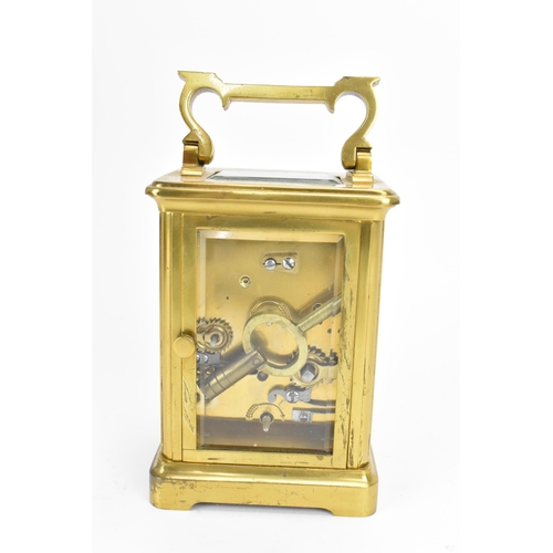 493 - A French brass and bevelled glass cased alarm clock, with white enamel face with Roman numerals, abo... 