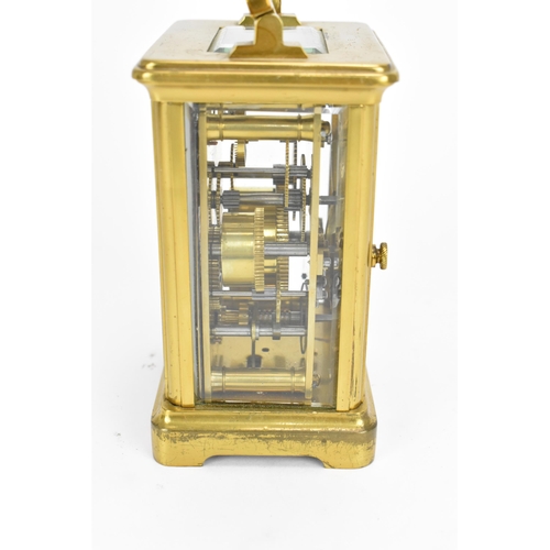 493 - A French brass and bevelled glass cased alarm clock, with white enamel face with Roman numerals, abo... 