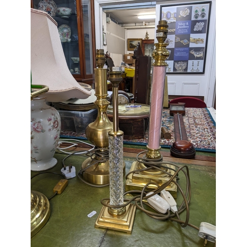 298 - A selection of table lamps to include a brass effect Banker's lamp with green glass shade, a black c... 